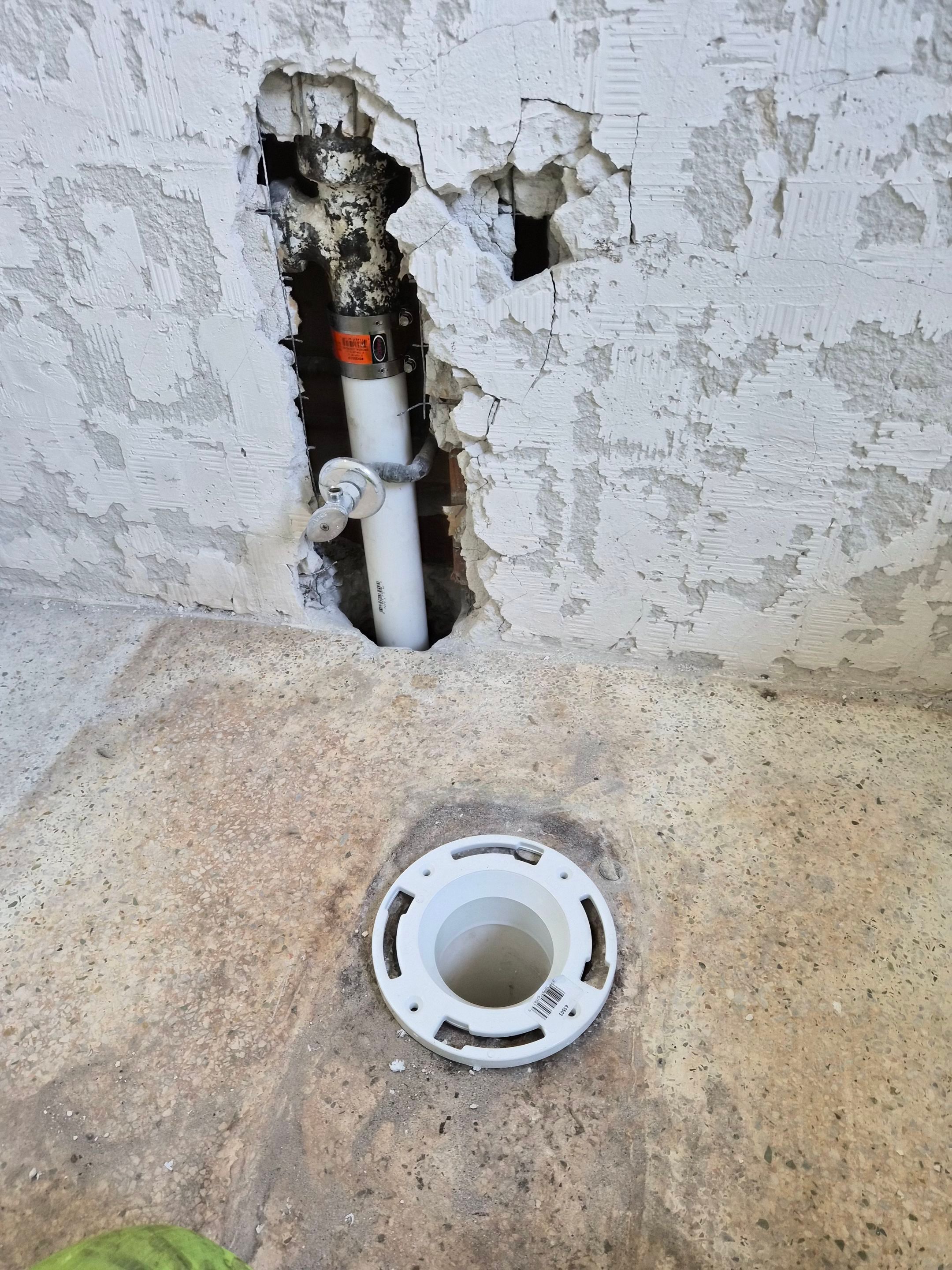 Cast Iron Replacement — North Corals, East Oakland Park — after: The existing 2-inch cast-iron sanitary stack in the guest bathroom replaced with New 4-inch PVC toilet flange and new 2" schedule 40 solid-wall PVC DWV pipe and 2" code approved pro seal transition coupling from PVC to cast-iron piping