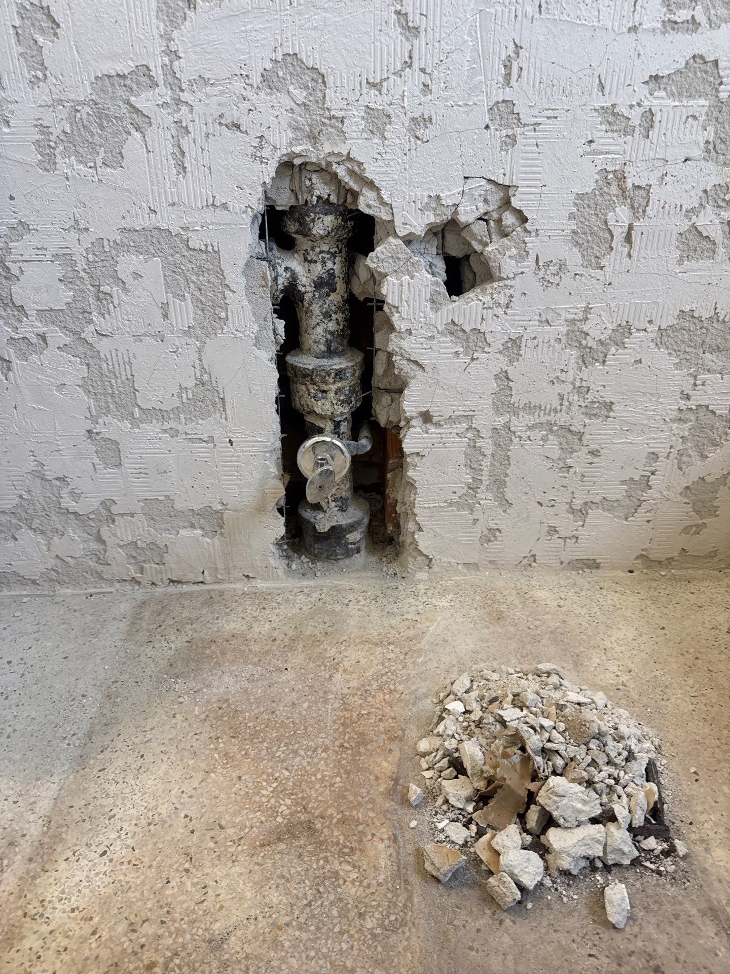 Cast Iron Replacement — North Corals, East Oakland Park — before: The existing 2-inch cast-iron sanitary stack in the guest bathroom replaced with New 4-inch PVC toilet flange and new 2" schedule 40 solid-wall PVC DWV pipe and 2" code approved pro seal transition coupling from PVC to cast-iron piping