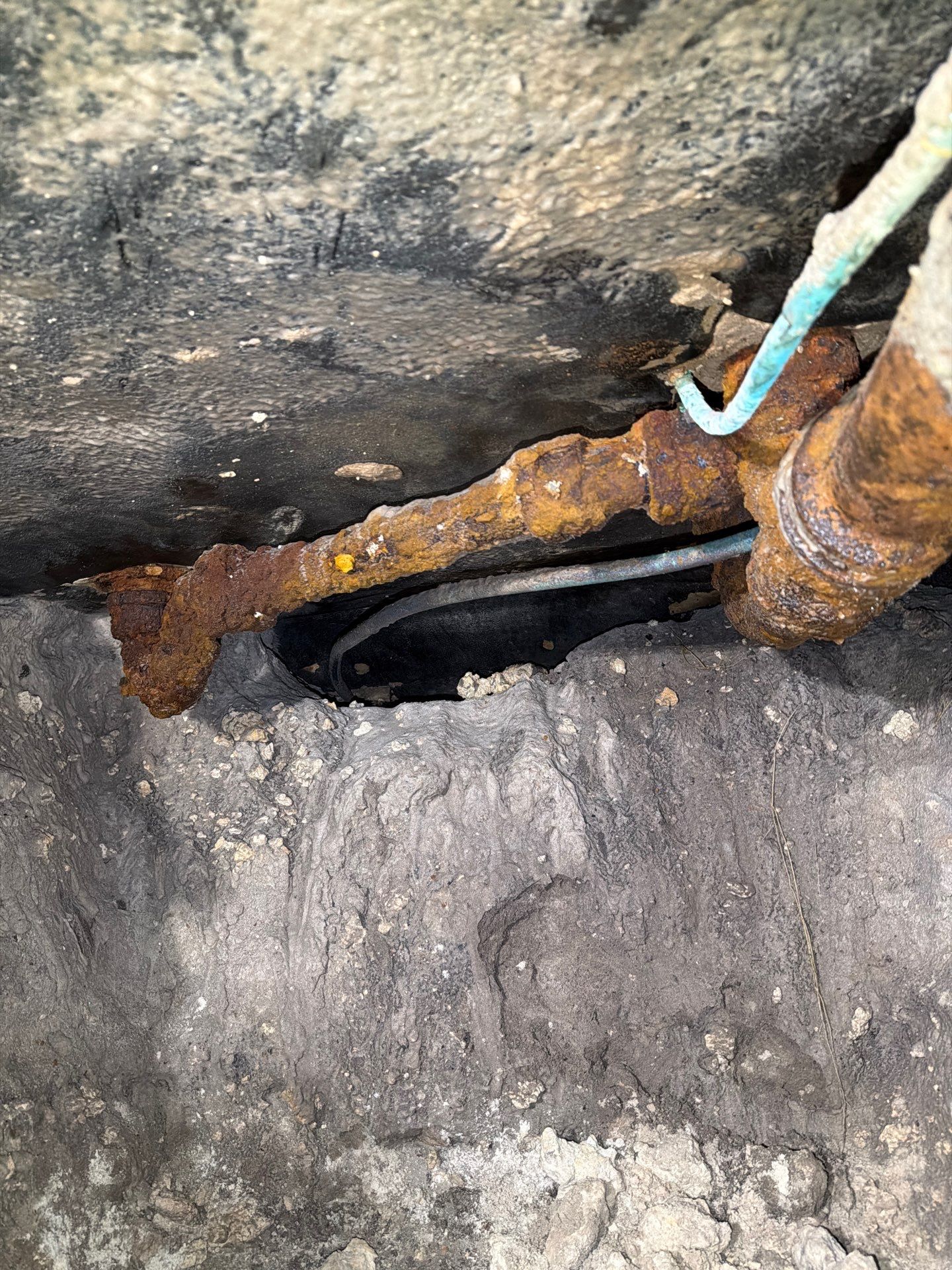 Cast Iron Replacement — North Corals, East Oakland Park — before: Access and egress to the Cast Iron Master Bathroom group, shower fixture P-trap and shower fixture branch drain beneath the slab replaced with PVC